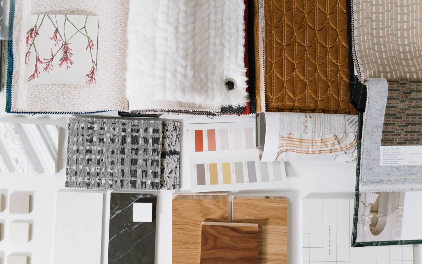 Assorted textile sample books showing different fabric textures and constructions